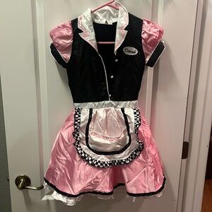 Child’s medium Dinah girl Halloween costume. Pink black and white checkered